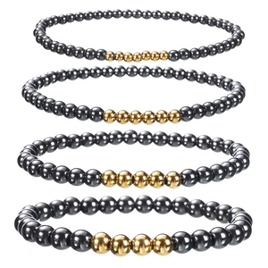Black obsidian and hematite elastic bead bracelets for men with gold accent spacers