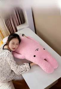 Detail of pink long rabbit plush pillow with soft bumpy bean velvet texture and cute face