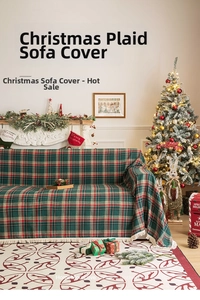 Detail of Christmas plaid sofa throw with festive red and green pattern and white fringes