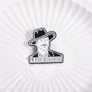 Enamel brooch with Doc Holliday portrait and I'M YOUR HUCKLEBERRY quote on ceramic tray