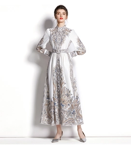 Detail of vintage blue baroque print on white maxi dress with lantern sleeves and belt