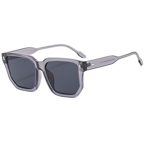 Fashionable square frame sunglasses in transparent grey with dark lenses from a side view