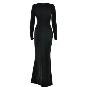 Back view of a black bodycon maxi dress with long sleeves and a fishtail slit hemline