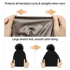 Black knit beanie with satin lining and pom pom for curly and straight hair protection