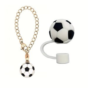 Detail of soccer charm golden metal cup chain and white silicone straw cap accessory