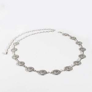 Macro detail of vintage silver waist chain with sunflower pattern and lobster clasp