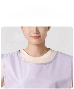 Detail of the widened neckline on a purple breathable mesh kitchen apron for easy wearing