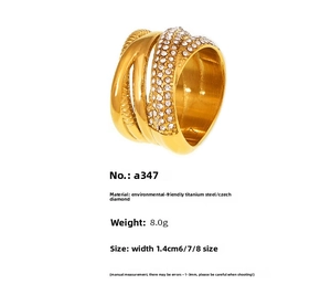 Detailed view of layered 18k gold plated titanium ring with woven pave rhinestones