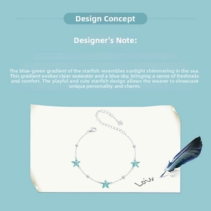 Detail of silver starfish bracelet featuring blue-green gradient charms and lobster clasp