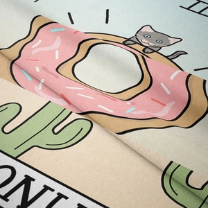 Close-up of bohemian tapestry showing soft woven texture and cute cat donut print