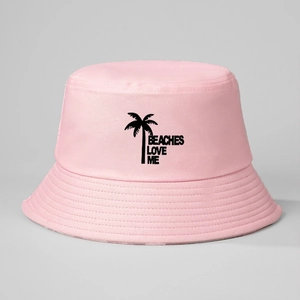 Pink bucket hat with black palm tree and BEACHES LOVE ME print on light grey background