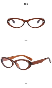 Front and side views of tea-colored vintage oval eyeglasses frames with silver accents