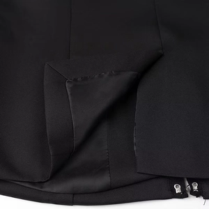 Detail view of the black fabric lining with stitching and functional zipper hardware