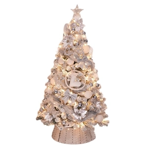 Silver and white decorated Christmas tree with LED lights and woven basket base