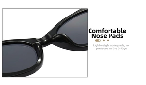 Macro detail of ergonomic one-piece nose pads on black oval sunglasses for comfort