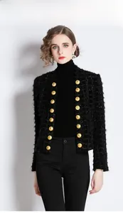 Close-up of black tweed cardigan featuring textured fabric and luxury gold buttons