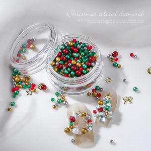 Christmas nail art jewelry set with colorful beads, metal stars and bows in a clear box