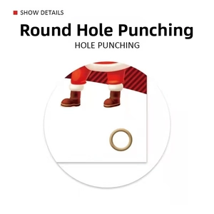Macro detail of Christmas paper tags featuring hole punching and Santa Claus design