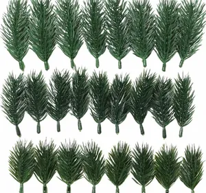 Detailed grid of 24 artificial green pine needles for Christmas DIY floral arrangements