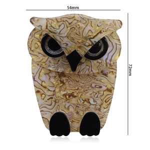 Detailed view of acrylic owl brooch measuring 54mm by 72mm with tortoiseshell texture