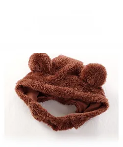 Close-up of brown plush baby hood with cute bear ears and metallic snap fasteners