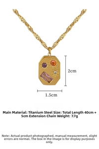 Detail of titanium steel octagon pendant with colorful gems and solar rays pattern