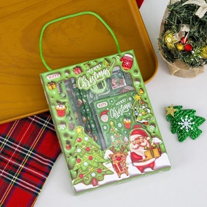 Detail of Christmas stationery set in green festive box with pencils and rulers