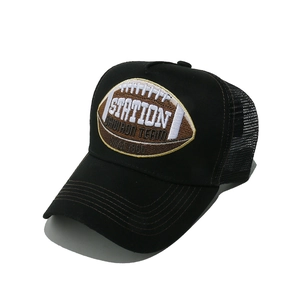 Detail of the high-quality rugby embroidery on black breathable mesh trucker cap