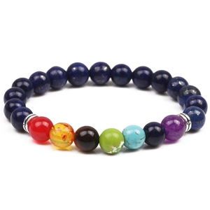 Detailed close-up of 8mm natural lava rock beads and colorful chakra stones on the bracelet