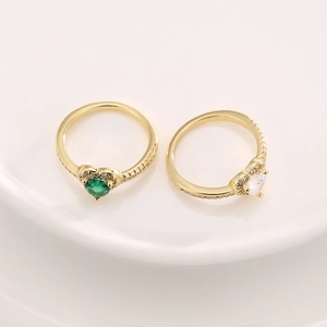Elegant gold heart-shaped ring with emerald and pink cubic zirconia and micro-pave side stones