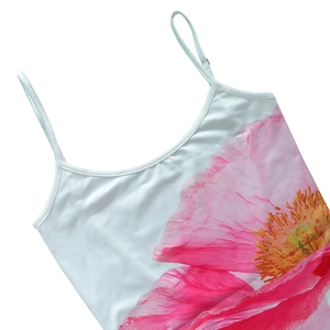 Detailed close-up of camisole with pink floral print and slim spaghetti straps