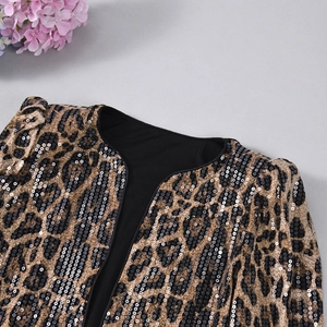 Detailed close-up of leopard print sequin blazer with gold and brown embroidery details