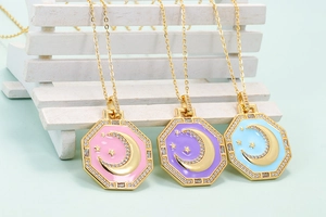 Detailed macro view of colorful enamel octagon pendants with moon and star zircon inlay