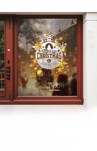 Detail of gold Merry Christmas window stickers with snowflake and reindeer decals