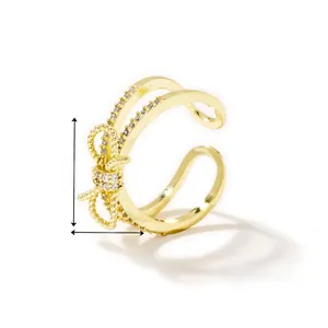 Detail view of adjustable gold butterfly ring with dimensions 1.5cm by 1cm