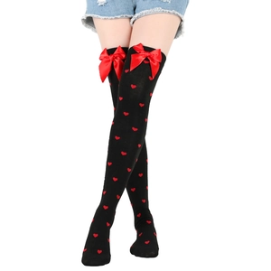Black over-the-knee socks with red heart patterns and decorative bows for women