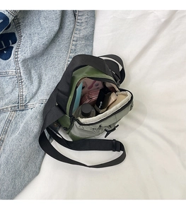 Detail view of the mini nylon crossbody bag interior showing spacious storage space