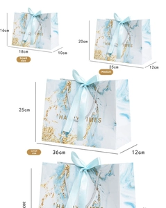 Size guide for marble pattern gift bags with gold accents and silk ribbon handles
