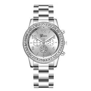 Detail of silver Geneva watch with rhinestone bezel and sunray dial for women