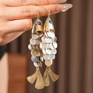 Vintage gold fish earrings with mother of pearl scales and long tassel drop design