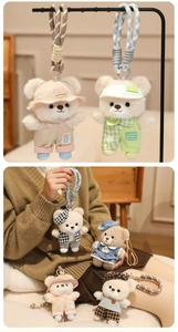 Detail of plush teddy bear charms with woven ropes and cute handmade style outfits