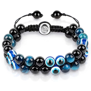 Detail of double-layered blue tiger eye stone beads bracelet with evil eye charm on white