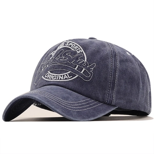 Detail of vintage navy blue baseball cap showing 3D sports embroidery and stitching