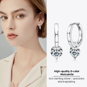 Close-up of S925 sterling silver drop earrings featuring brilliant D color moissanite stones