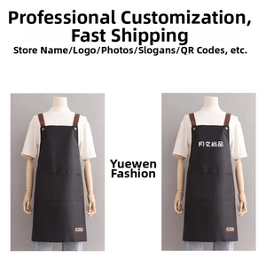 Detail of waterproof dark grey apron with dual pockets and brown contrast straps