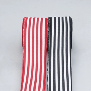 Close-up of red, white, and black striped wired faux linen ribbon for DIY holiday decor