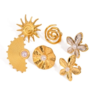 Exaggerated floral ring set in 18K gold stainless steel with pearls on white background