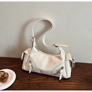 Chic cream white high-gloss dumpling bag with multi-pocket design and adjustable strap