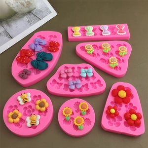 Pink silicone mold set for handmade sunflower bee and bowknot shaped cake decorations