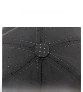 Close-up of a black mesh baseball cap showing top button and reinforced stitching